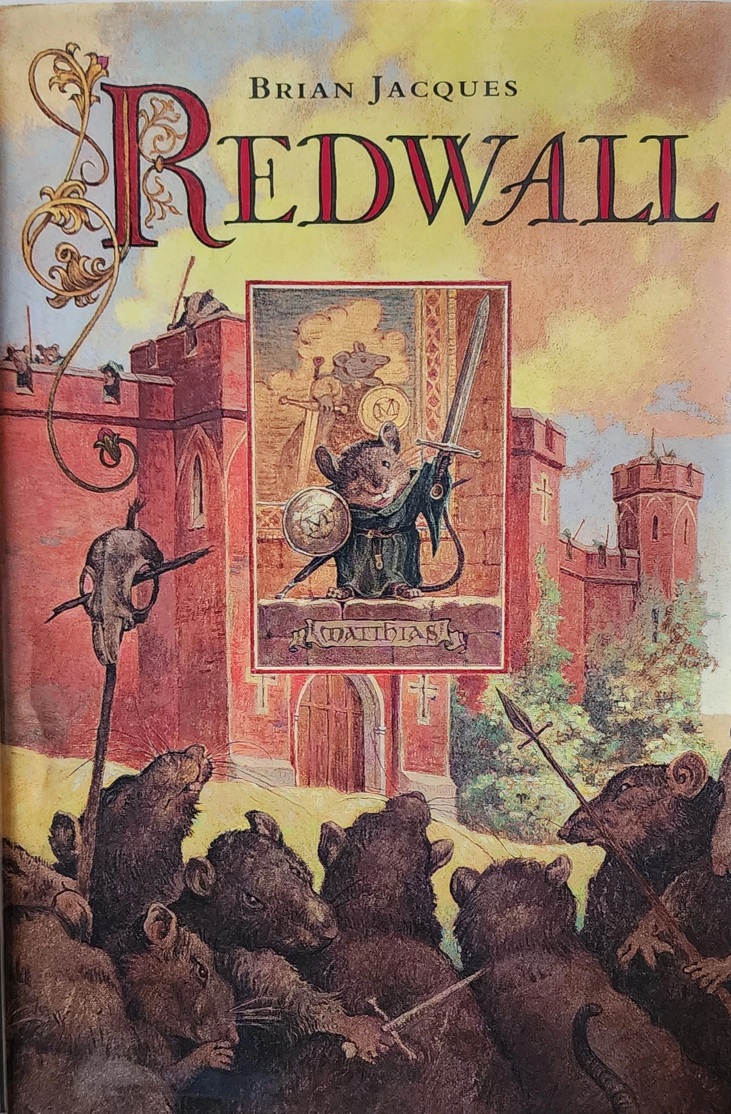 The Cover of The Redwall Book It depicts a mous, redwall abbey, and a horde of devious rats.